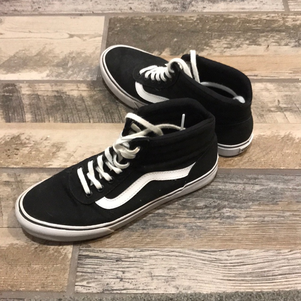 Black and white high top vans